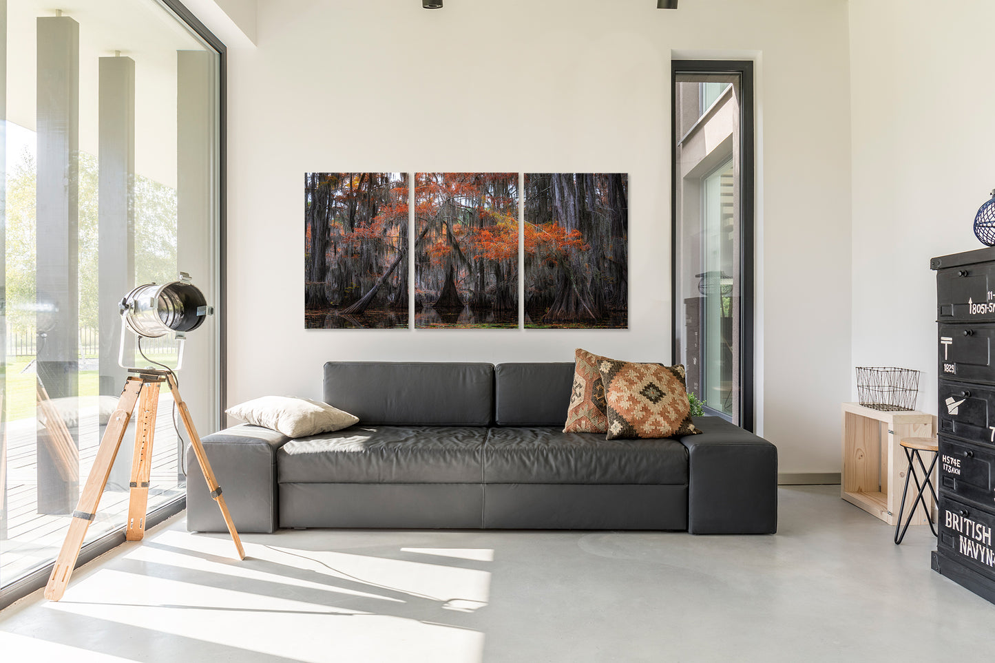 Modern living room with a gray sectional sofa, decorative pillows, and wall art.