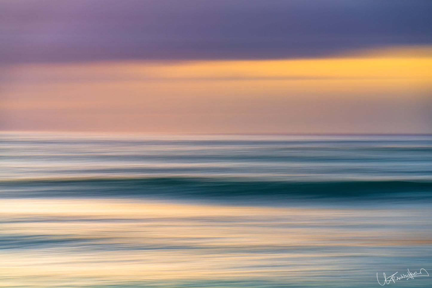 Abstract seascape with blurred water and colorful sky
