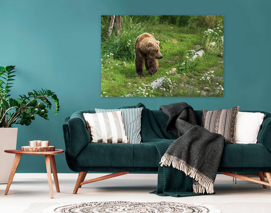 Living room with a green sofa, decorative pillows, and a large wall art of a bear in a field.