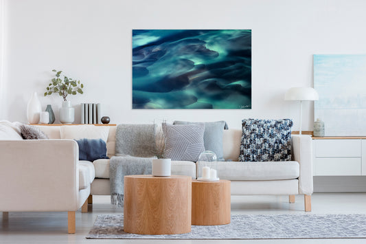 Living room with a large abstract painting on the wall, beige sofa, and wooden coffee table.