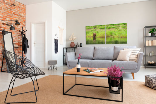 Modern living room with gray sofa, coffee table, and a diptych photograph on the wall.