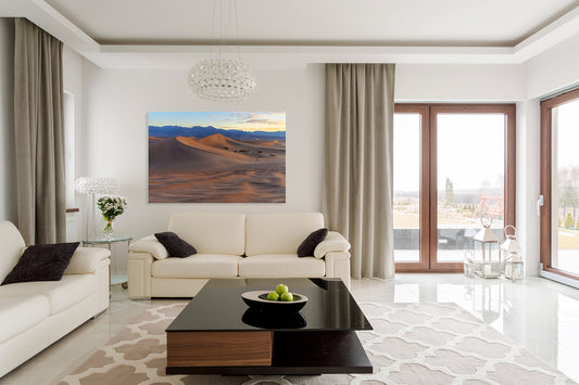 Modern living room with white sofa, coffee table, and large fine art photography