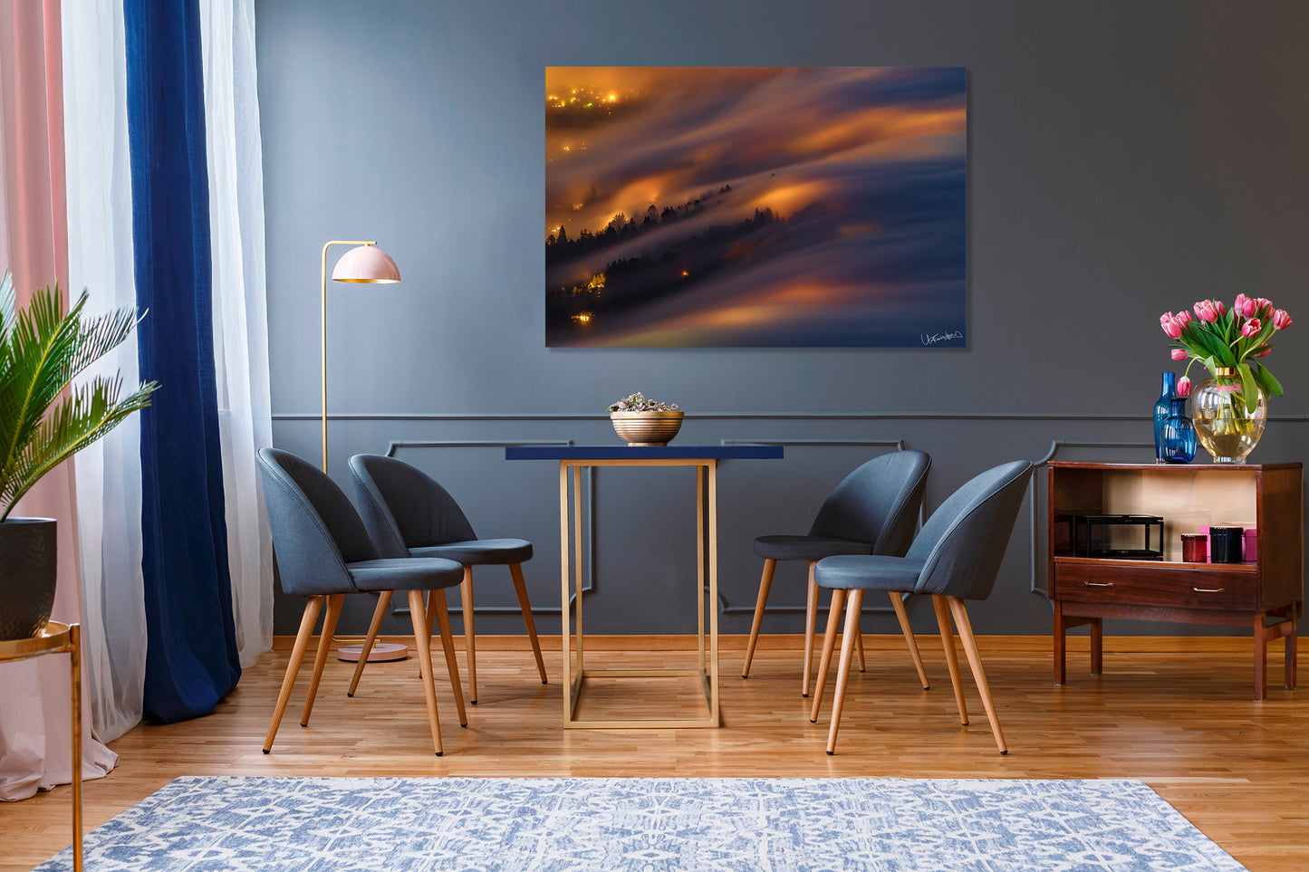 Dining room with modern chairs, a table, and a colorful abstract photograph on the wall.