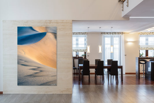 Modern interior with an extra large abstract photograph on the wall and a dining area in the background