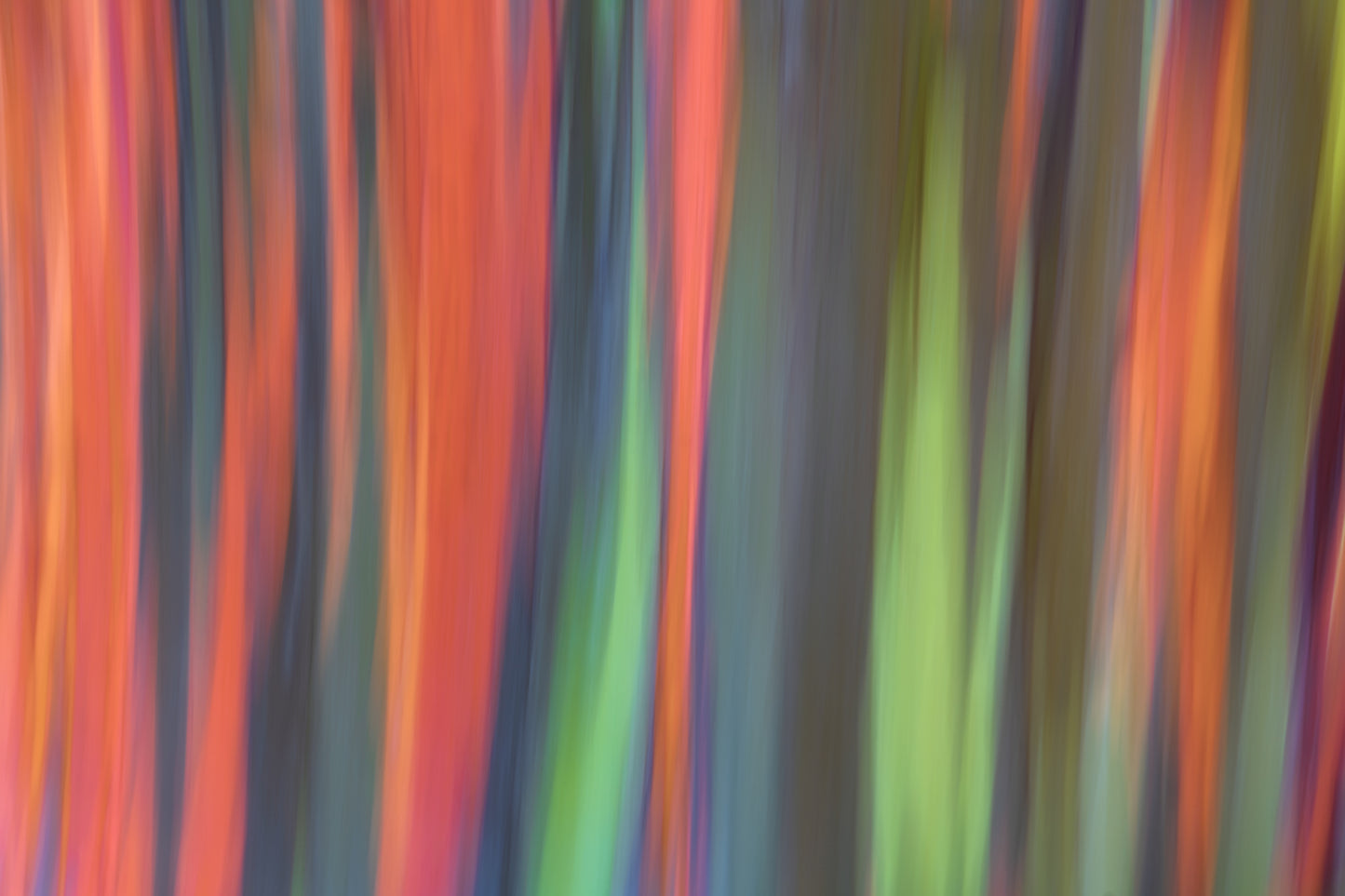 Abstract pattern of colorful vertical stripes on a dark background