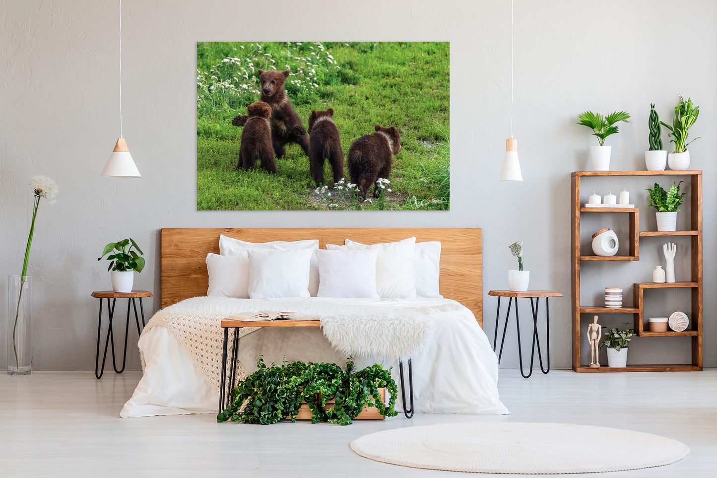 Bedroom with a wooden headboard and decorative plants, featuring a large wall art of bears.
