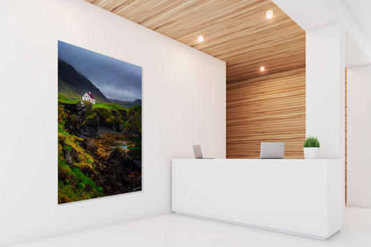 Modern interior with a scenic wall display and a reception desk.