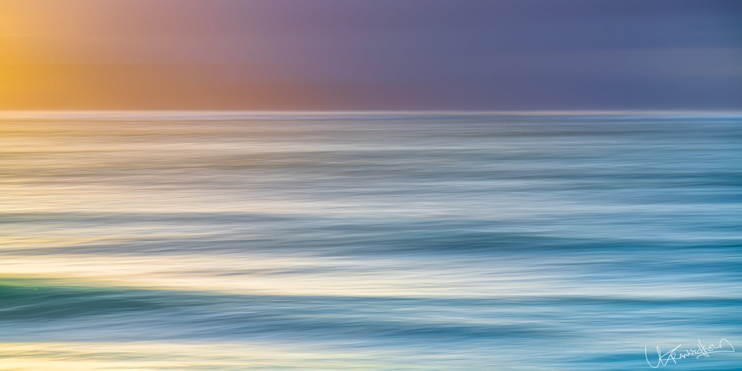 Abstract ocean scene with blurred water and colorful sky