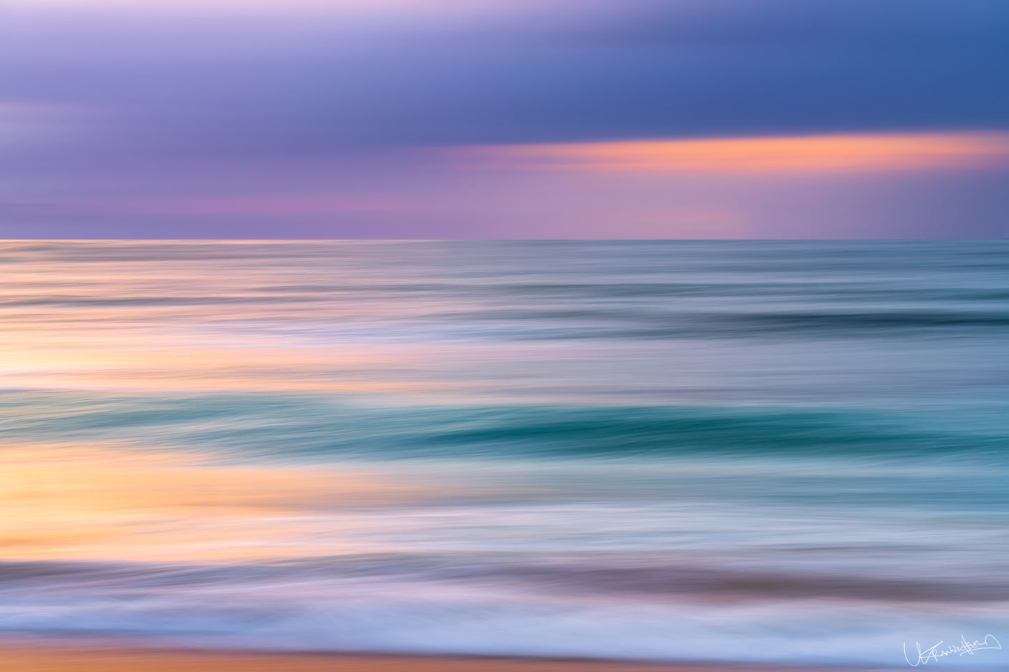 Abstract seascape with blurred water and colorful sky