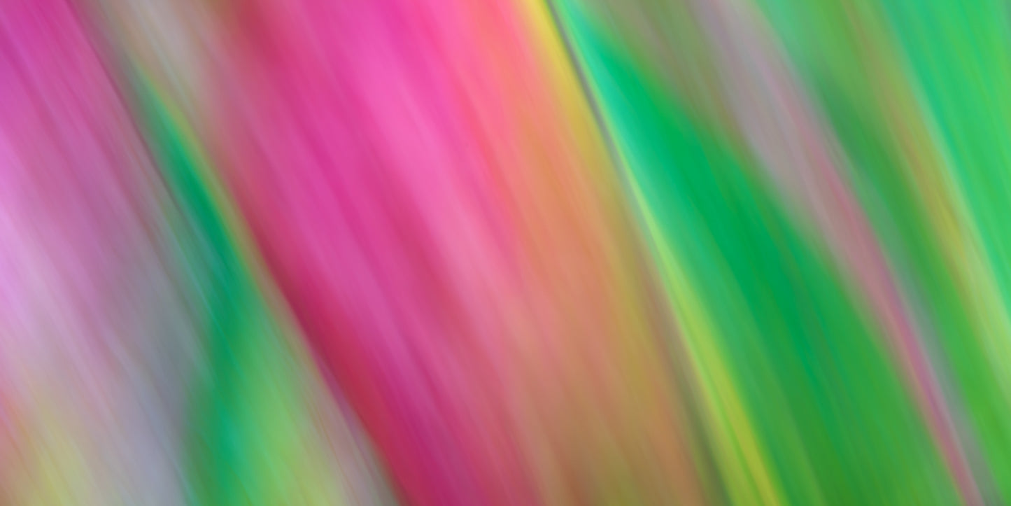 Abstract colorful background with pink, green, and yellow hues.
