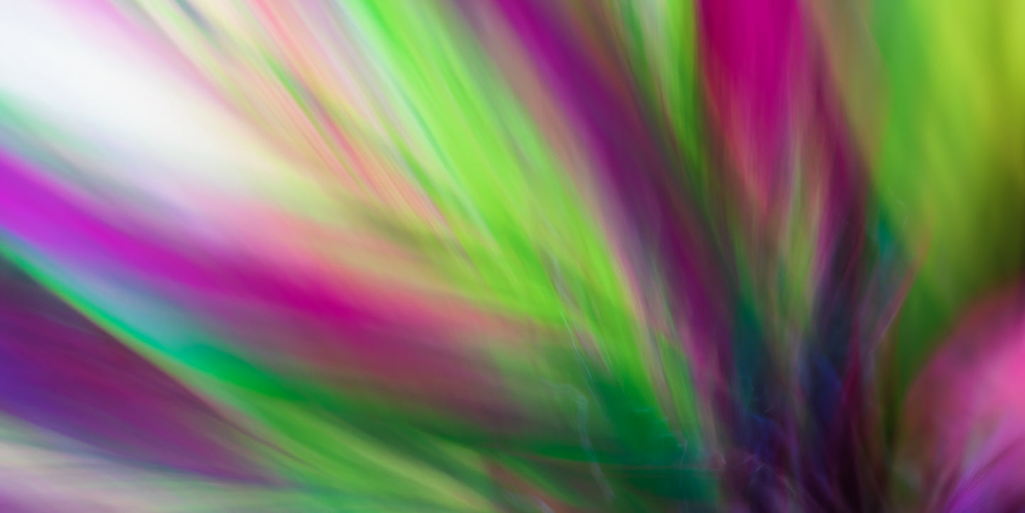 Abstract multicolored background with vibrant shades of green, pink, and purple.