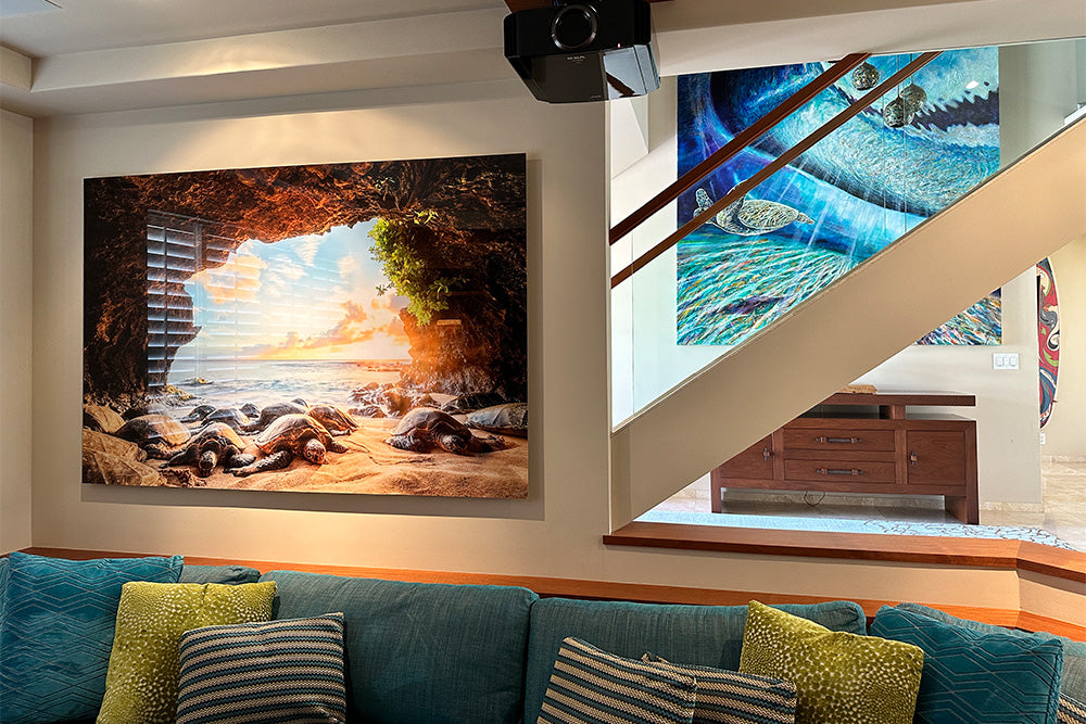 Living room with a large wall art, surrounded by decorative pillows on a sofa.