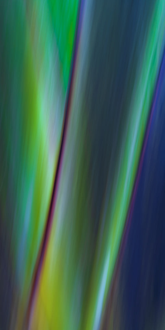 Colorful abstract pattern with vertical stripes in green, blue, and purple.