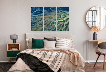 Bedroom with a large abstract wall art piece above the bed